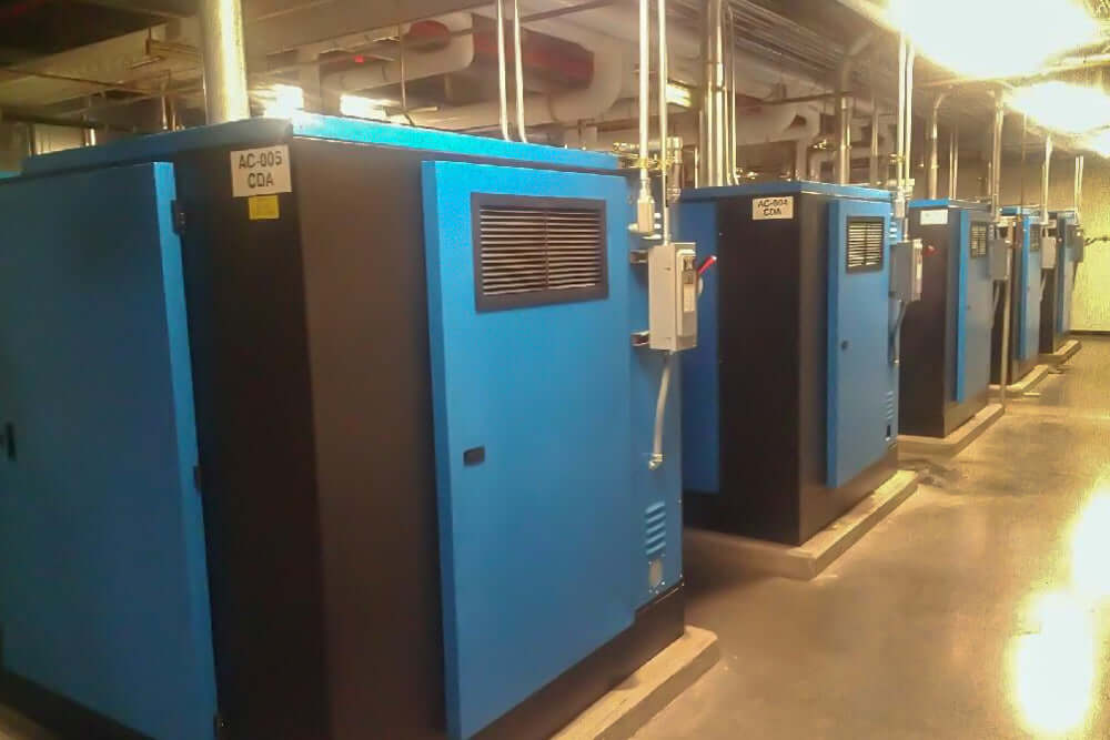 Rogers Machinery Company provides Rogers KNW oil-free rotary screw air compressor sequenced units for the electronics industry