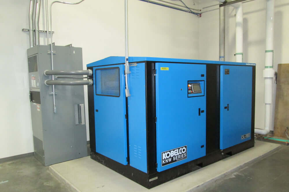 Rogers Machinery Company provides a Rogers KNW oil-free rotary screw air compressor with a VFD for the electronics industry
