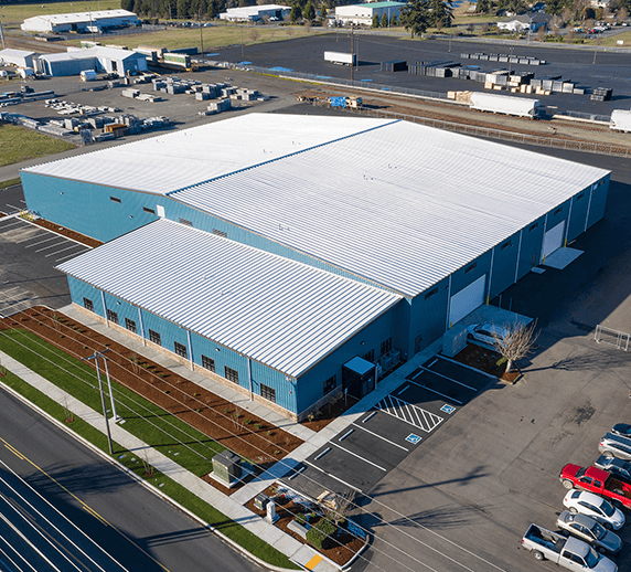 blue-building-with-a-grey-roof-at-Rogers-Machinery's-Centralia-Washington-air-compressor-and-vacuum-pump-manufacturing-facility-and-warehouse
