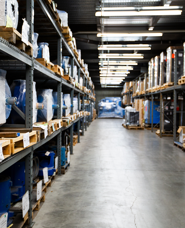 blue-pumps-on-wooden-pallets-in-Rogers-Machinery's-warehouse